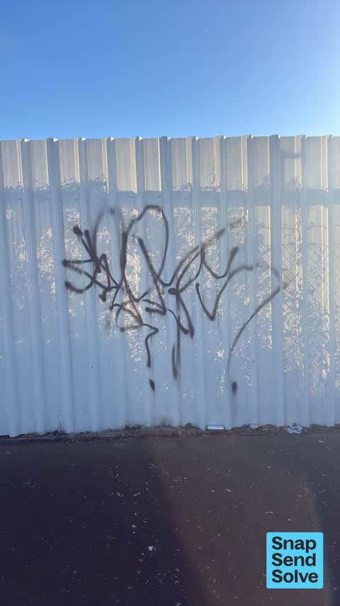 Graffiti on a fence, building or structure, a report photo