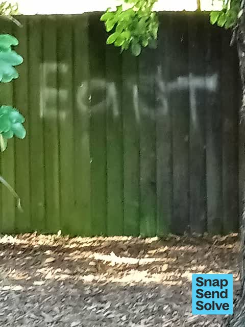 Graffiti on a fence, building or structure, a report photo