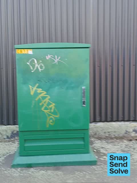 Graffiti on a fence, building or structure, a report photo