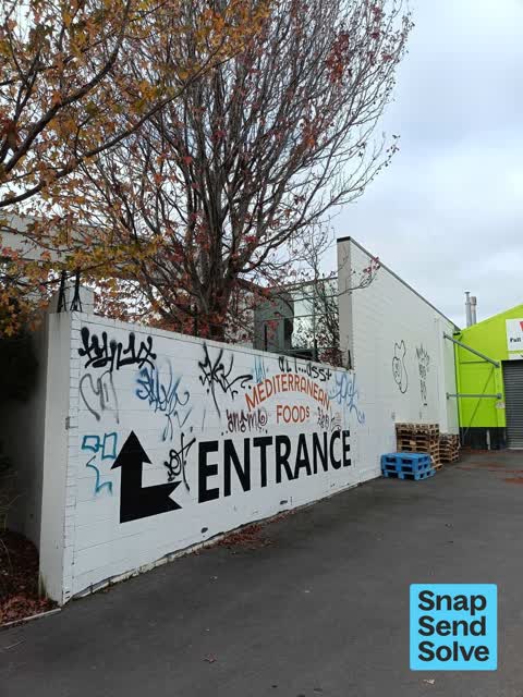 Graffiti on a fence, building or structure, a report photo