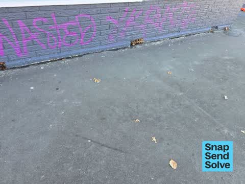 Graffiti on a fence, building or structure, a report photo