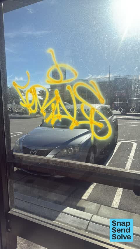 Graffiti on a bus stop or public toilet, a report photo
