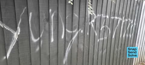 Graffiti on a fence, building or structure, a report photo