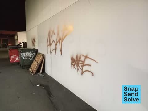 Graffiti on a fence, building or structure, a report photo