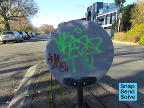 Graffiti on a traffic light pole or cabinet, or wa — a report photo