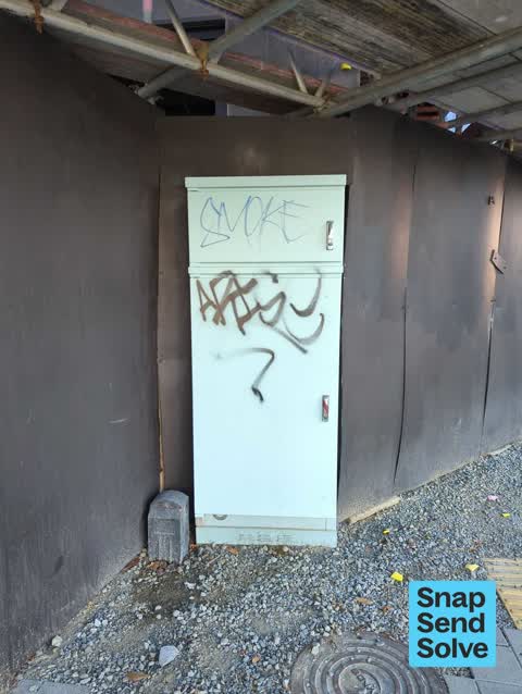 Graffiti on a traffic light pole or cabinet, or wa, a report photo