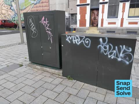 Graffiti on a traffic light pole or cabinet, or wa — a report photo