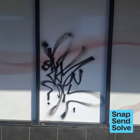 Graffiti on a fence, building or structure, a report photo