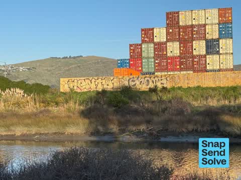 Graffiti on a fence, building or structure, a report photo