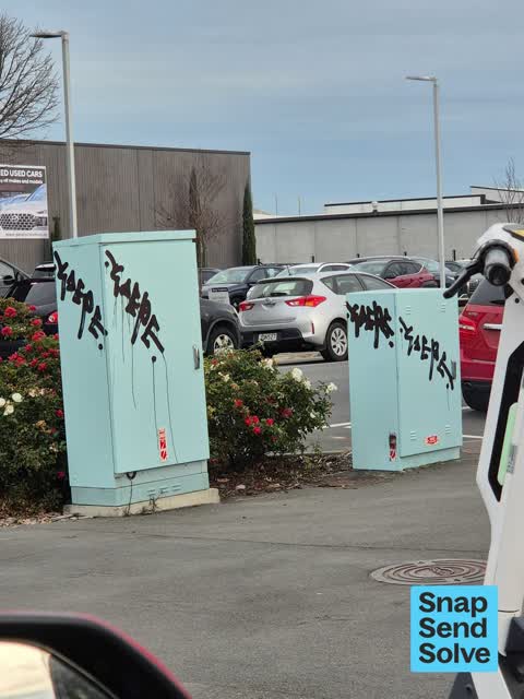 Graffiti on a traffic light pole or cabinet, or wa, a report photo