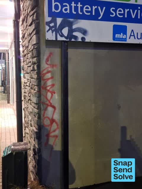 Graffiti on a fence, building or structure — a report photo
