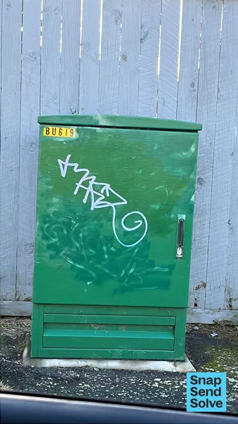 Graffiti on a traffic light pole or cabinet, or wa, a report photo