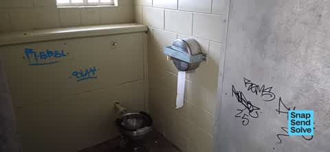 Graffiti on a bus stop or public toilet, a report photo