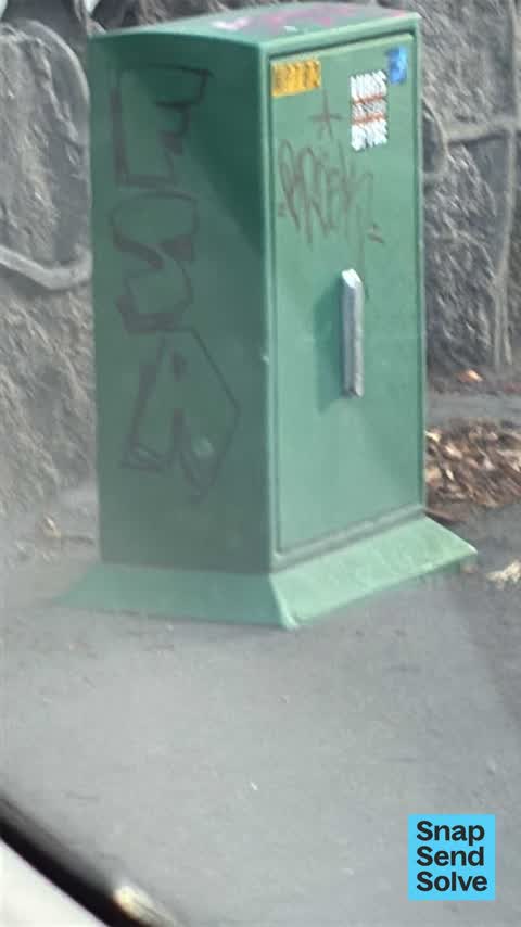 Graffiti on a fence, building or structure, a report photo