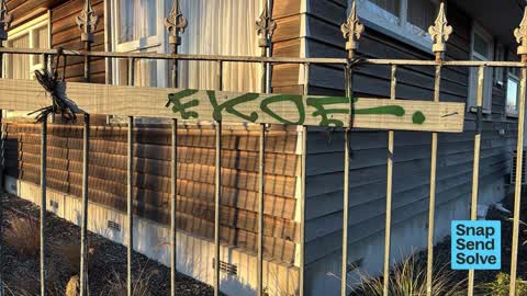 Graffiti on a fence, building or structure, a report photo