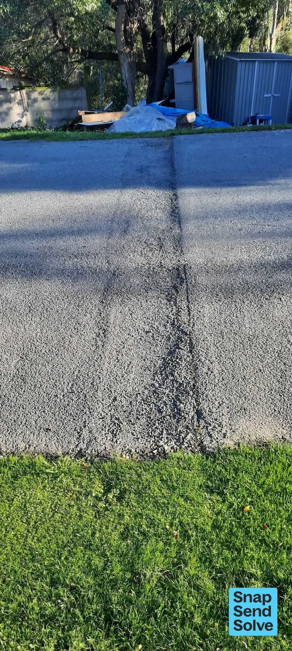 The photograph attached to this damaged road report