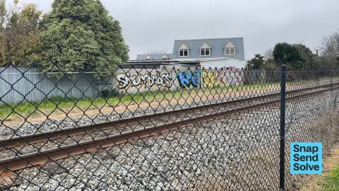 Graffiti on a fence, building or structure, a report photo