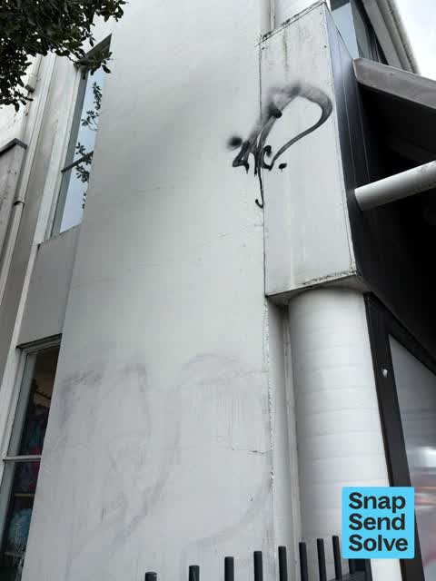 Graffiti on a fence, building or structure, a report photo