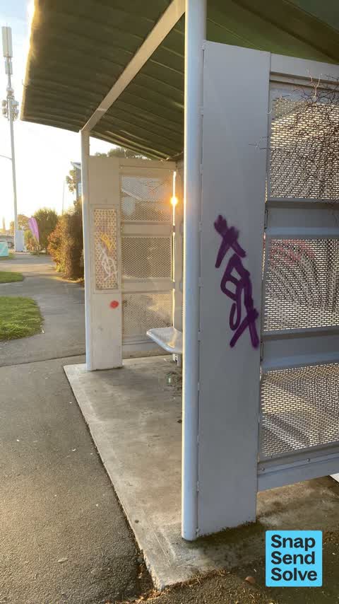 Graffiti on a bus stop or public toilet, a report photo