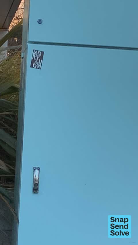 Graffiti on a traffic light pole or cabinet, or wa, a report photo