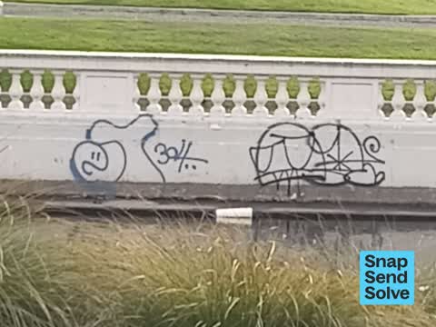 Graffiti on a fence, building or structure — a report photo