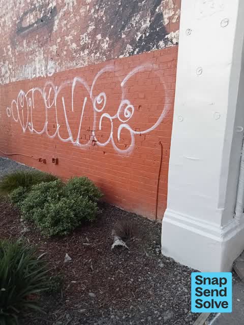 Graffiti on a fence, building or structure, a report photo