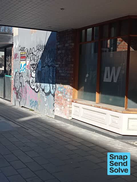 Graffiti on a fence, building or structure, a report photo