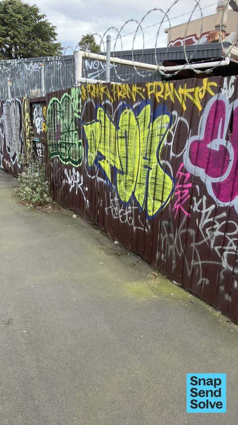Graffiti on a fence, building or structure, a report photo