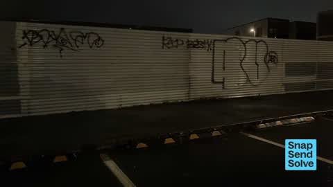 Graffiti on a fence, building or structure — a report photo