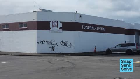 Graffiti on a fence, building or structure, a report photo
