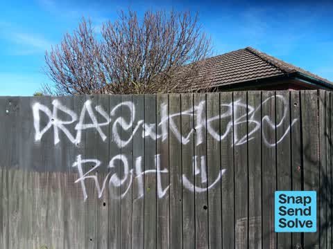 Graffiti on a fence, building or structure, a report photo