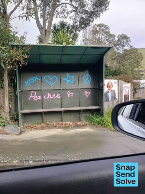 Graffiti on a bus stop or public toilet, a report photo