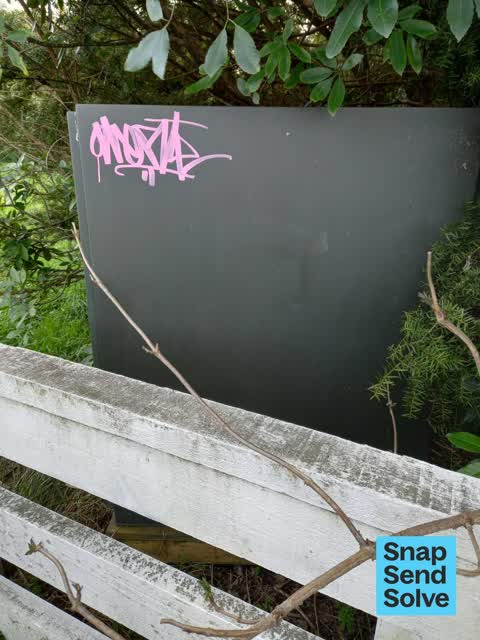 Graffiti on a fence, building or structure, a report photo