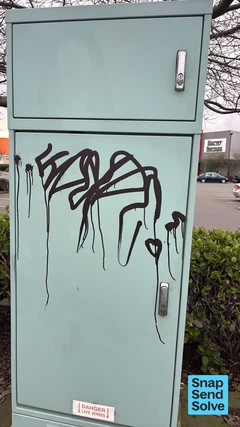 Graffiti on a traffic light pole or cabinet, or wa, a report photo