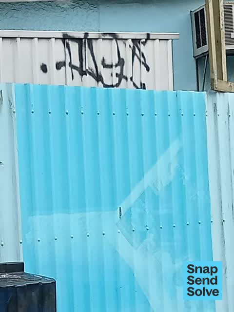 Graffiti on a fence, building or structure — a report photo