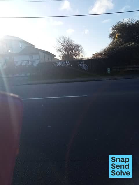Graffiti on a fence, building or structure, a report photo
