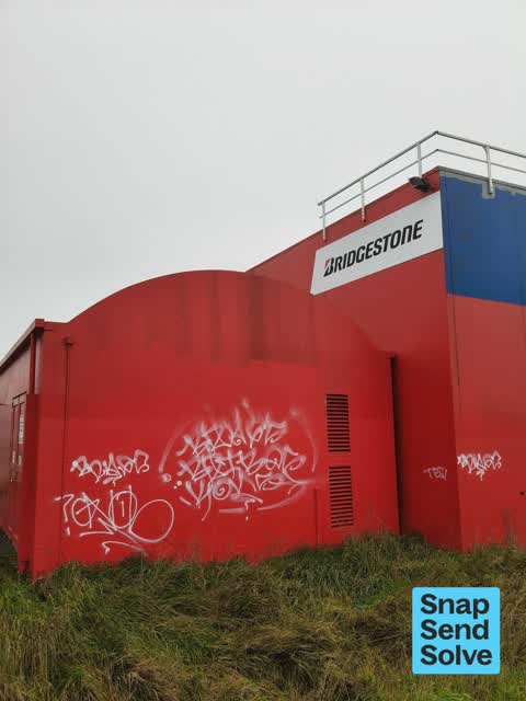 Graffiti on a fence, building or structure — a report photo