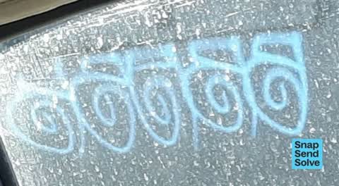 Graffiti on a fence, building or structure, a report photo