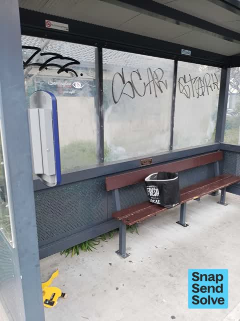 Graffiti on a bus stop or public toilet, a report photo