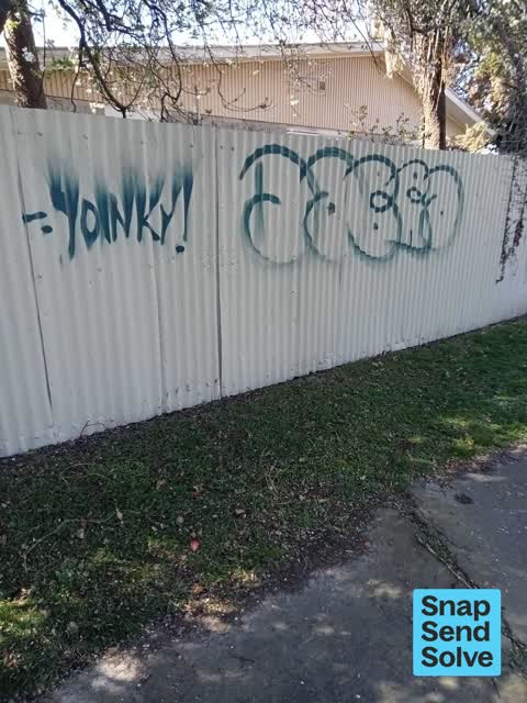 Graffiti on a fence, building or structure — a report photo