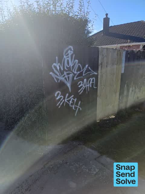 Graffiti on a fence, building or structure, a report photo