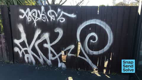 Graffiti on a fence, building or structure — a report photo