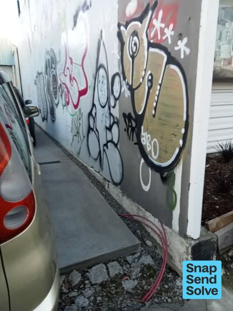 Graffiti on a fence, building or structure, a report photo