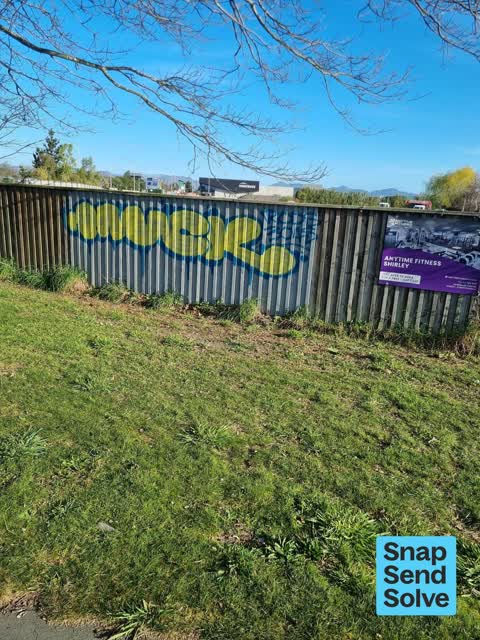 Graffiti on a fence, building or structure — a report photo