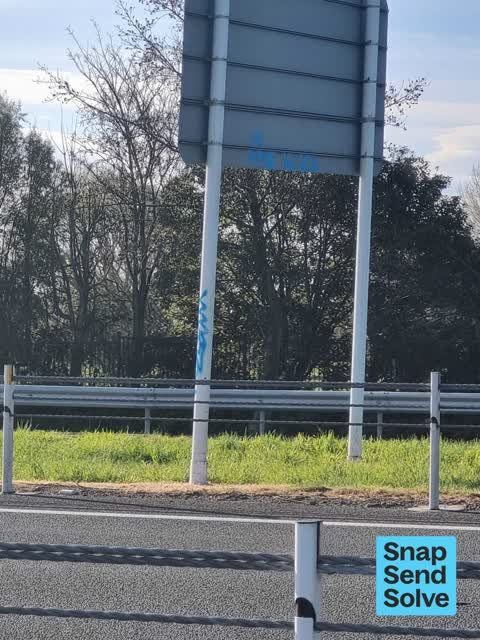 Graffiti on a traffic light pole or cabinet, or wa — a report photo