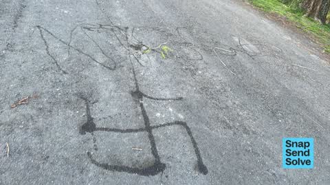 Graffiti on a road, footpath or bridge — a report photo
