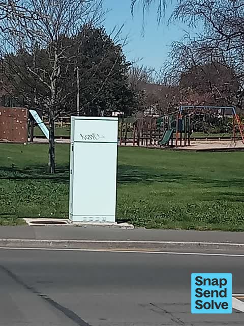Graffiti on a traffic light pole or cabinet, or wa — a report photo