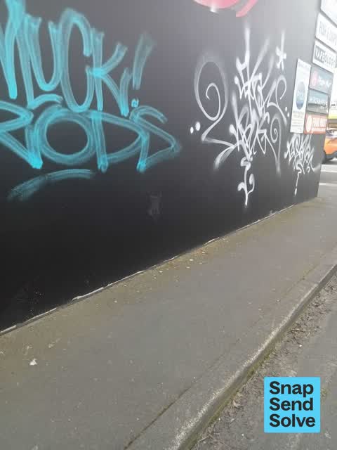 Graffiti on a fence, building or structure — a report photo
