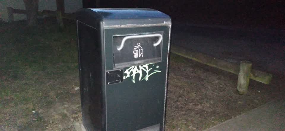 The photograph attached to this graffiti on a playground or in a park report