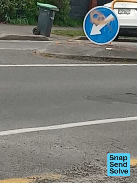 Graffiti on a sign, mural or public art, a report photo